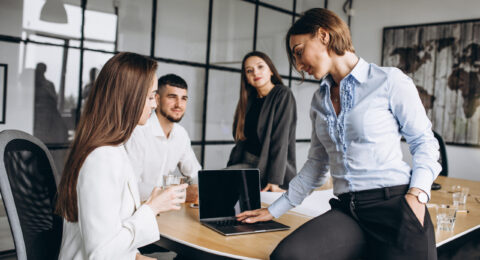 Group of people working out business plan in an office