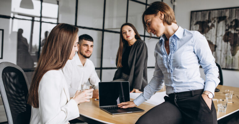 Group of people working out business plan in an office