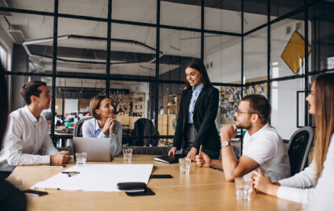 Group of people working out business plan in an office